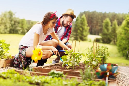 Gardener wearing protective gear preparing a gardening site