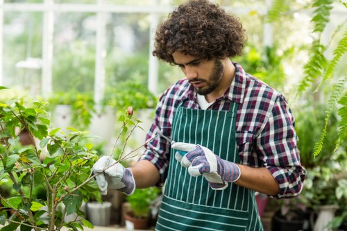 Gardener assessing a garden with clipboard